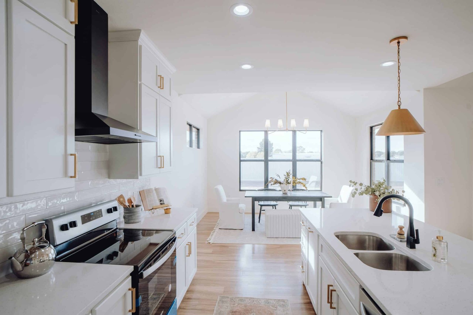 A bright white kitchen after a professional cleaning